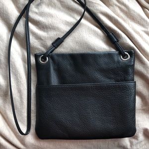 Black real leather cross body bag.